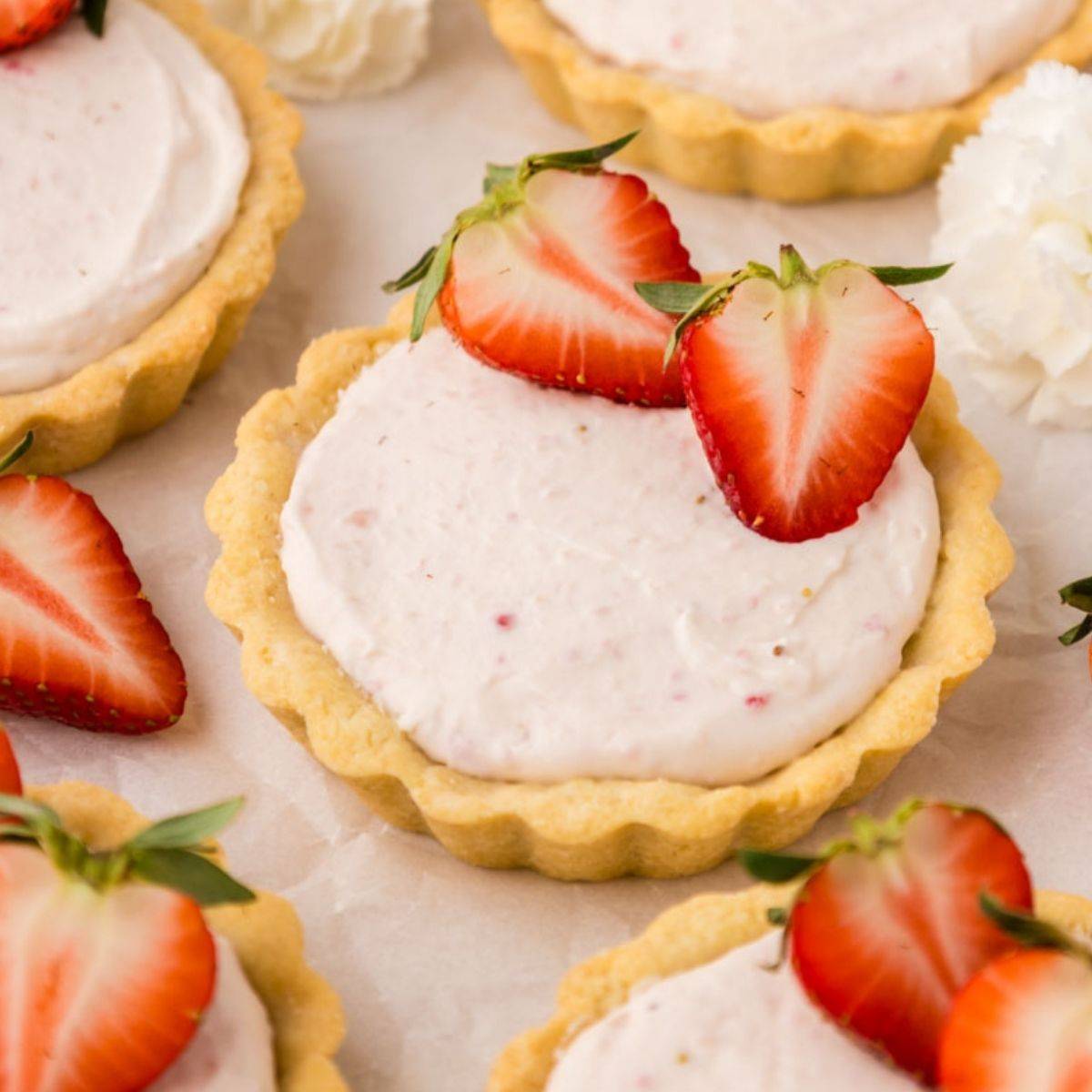 Strawberry tarts with fresh strawberries.
