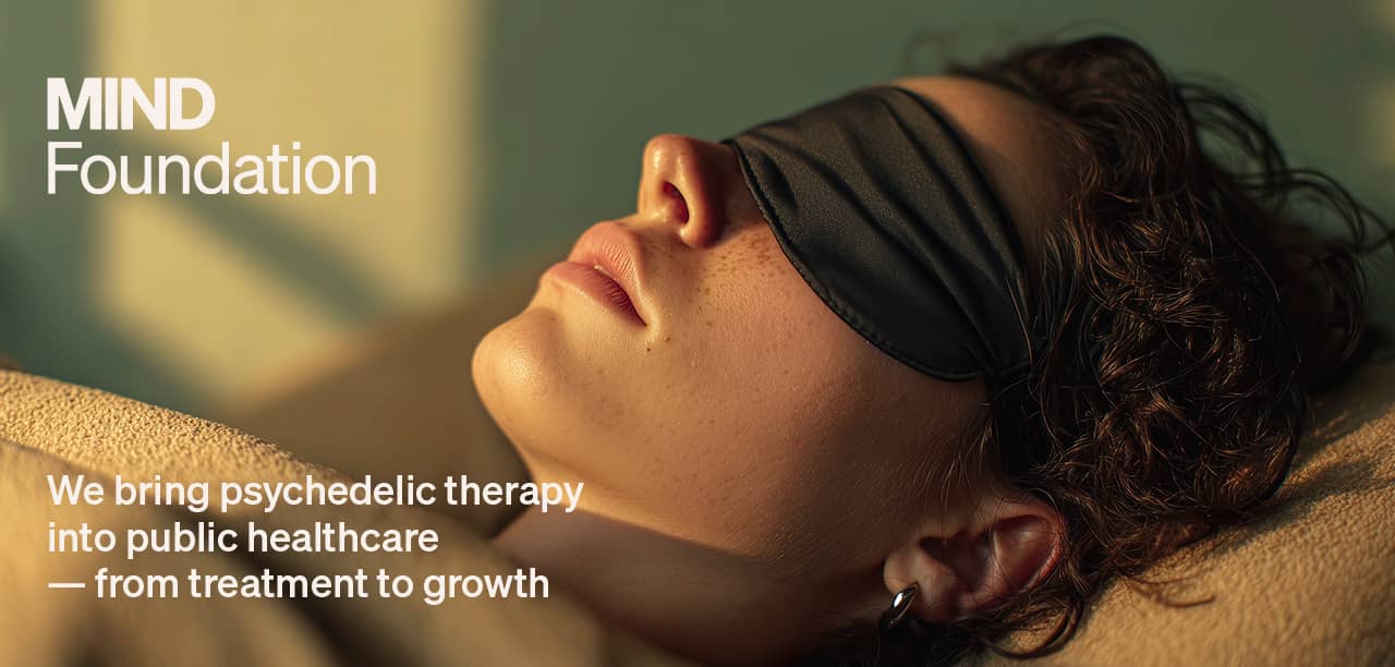 Young woman with eyeshades in psychedelic therapy setting