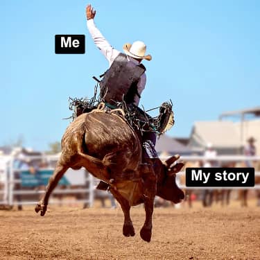 A man riding a bucking bull