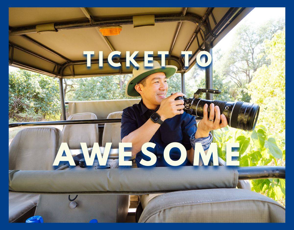 will holding a camera while on safari in zambia with ticket to awesome text overlay