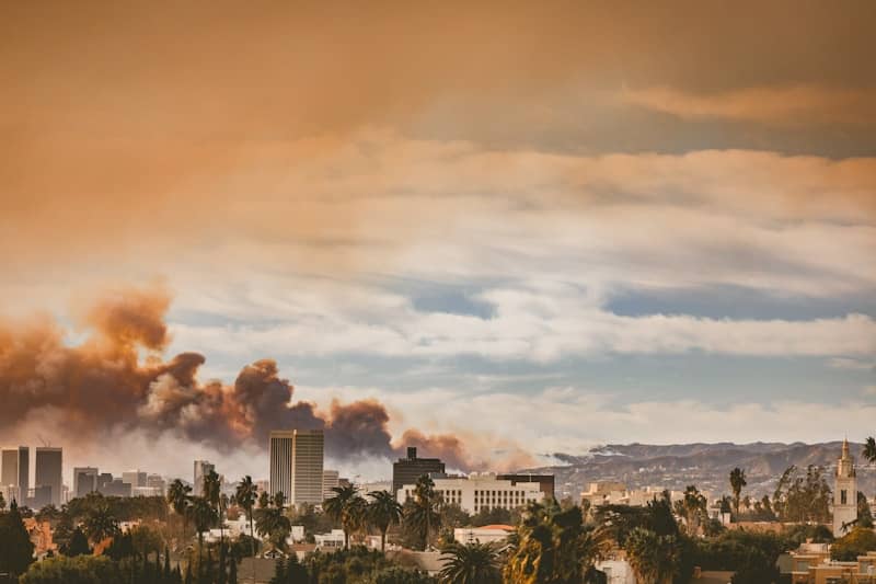 A city with a lot of smoke coming out of it