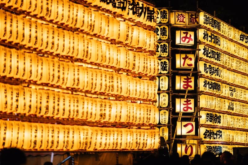 Rows of illuminated japanese lanterns at night
