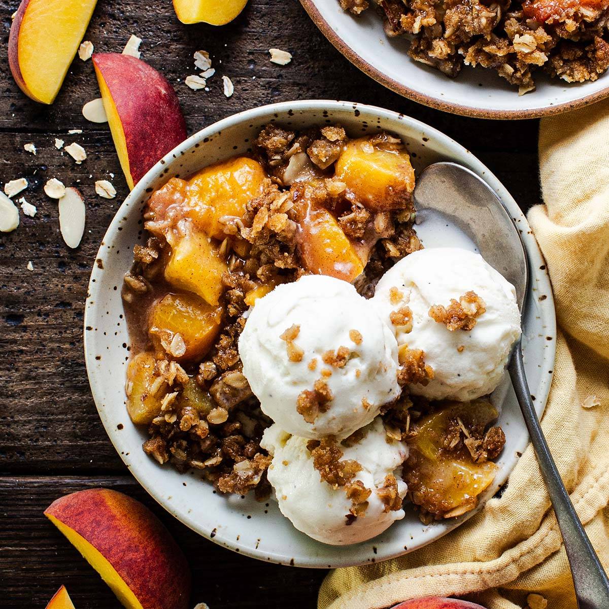 bowl of gluten free peach crisp