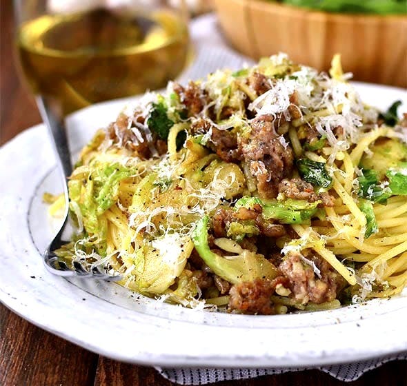 plate of sausage, brussels sprouts and parmesan pasta