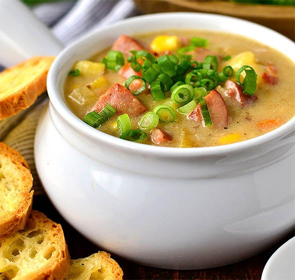 bowl of sweet corn, kielbasa, and potato soup