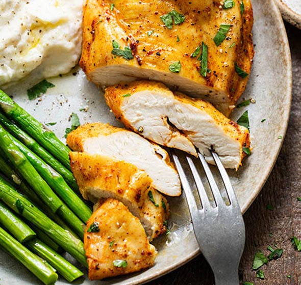 plate of sliced air fryer chicken breast