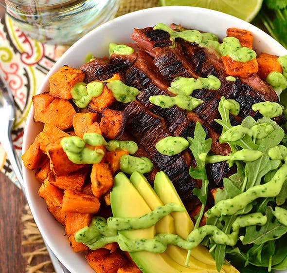 overhead of bowl of steak and sweet potato bowls