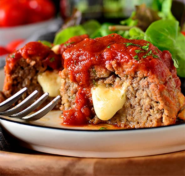 plate of stuffed italian mini meatloaf