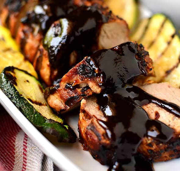 sliced grilled pork tenderloin on platter