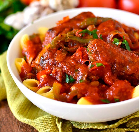 bowl of crock pot sausage and peppers