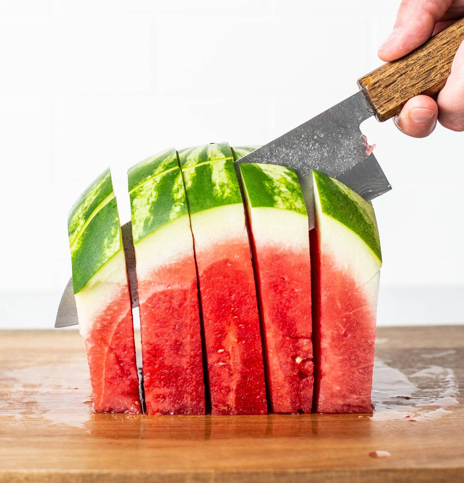 knife cutting watermelon into sticks