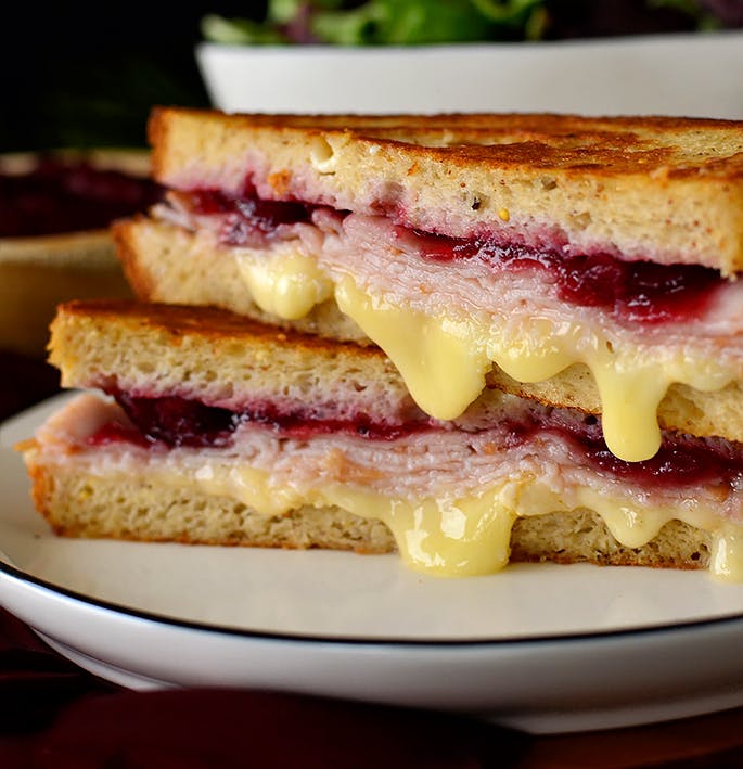 holiday grilled cheese sandwich sliced in half