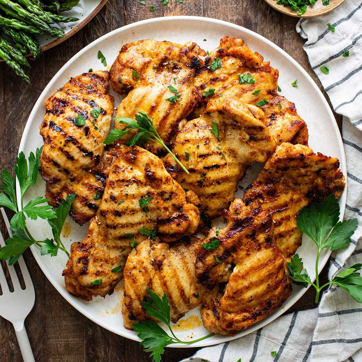 platter of grilled chicken thighs