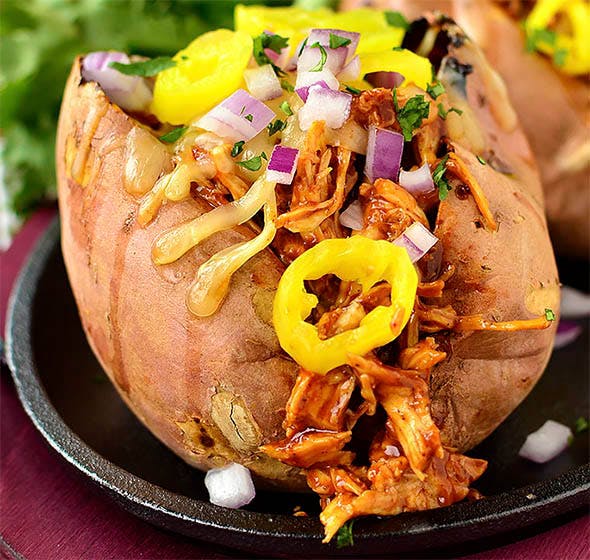 bbq chicken stuffed sweet potato on platee