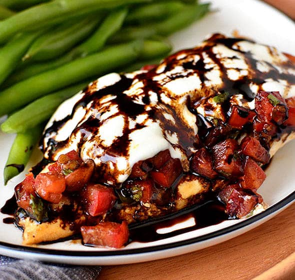 plate of mozzarella chicken on plate