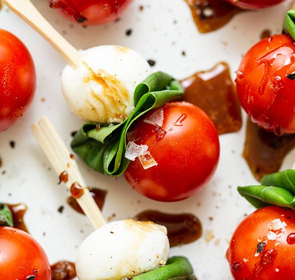 plate of caprese skewers