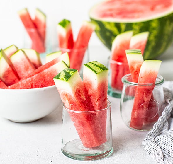 photo of glasses of watermelon sticks