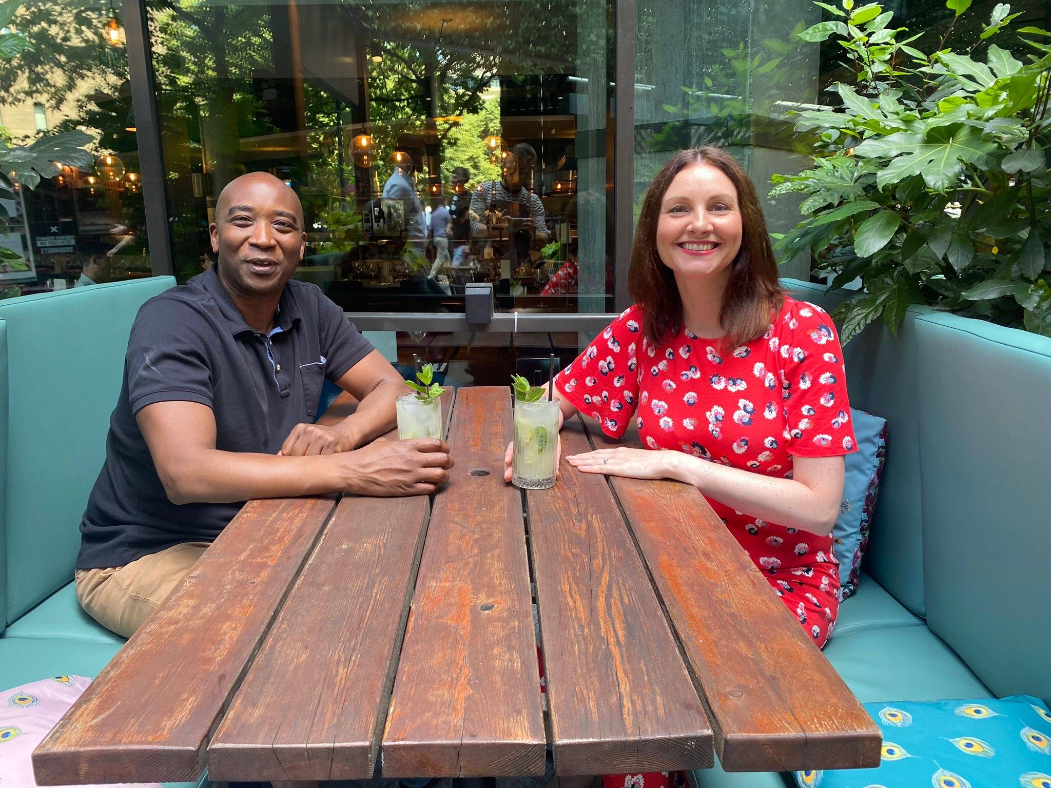 Jonathan and Fay sitting at a table, with mocktails