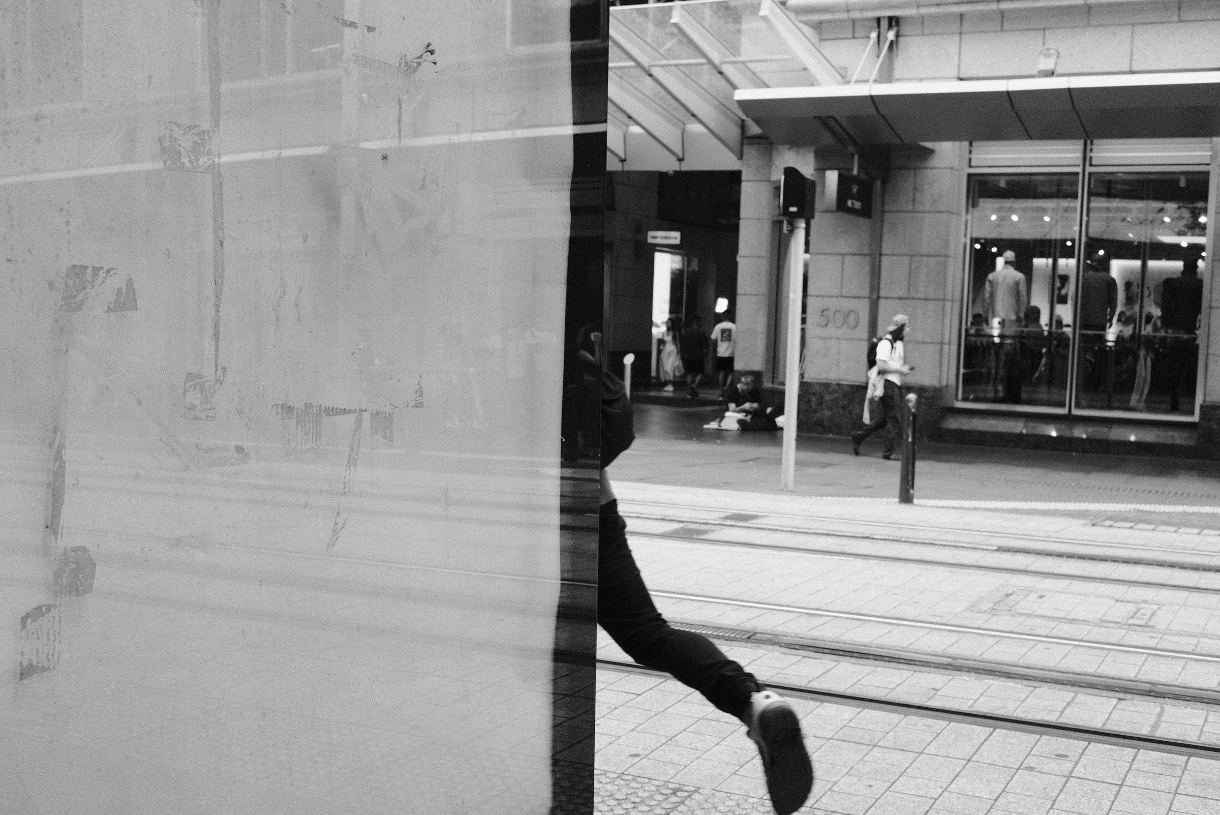 Man walking out of the image