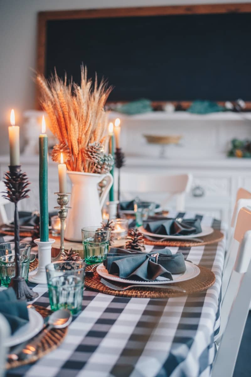 white candles on glass holder