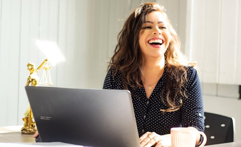 smiling laughing woman with laptop