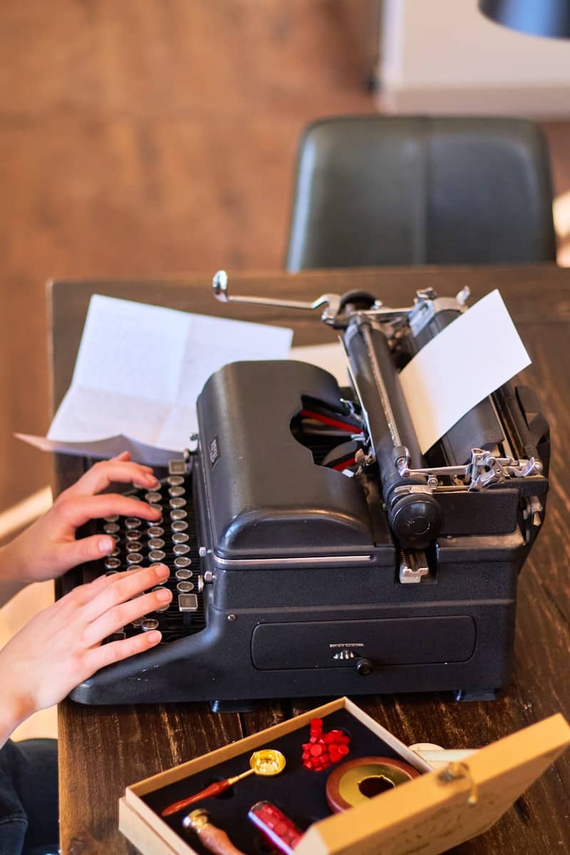 Someone is typing on a vintage typewriter.