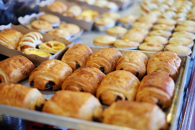 close up photography of French pastries on tray