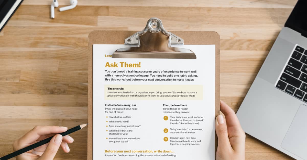 Mockup of the ask them worksheet on a clipboard against a wood desk.