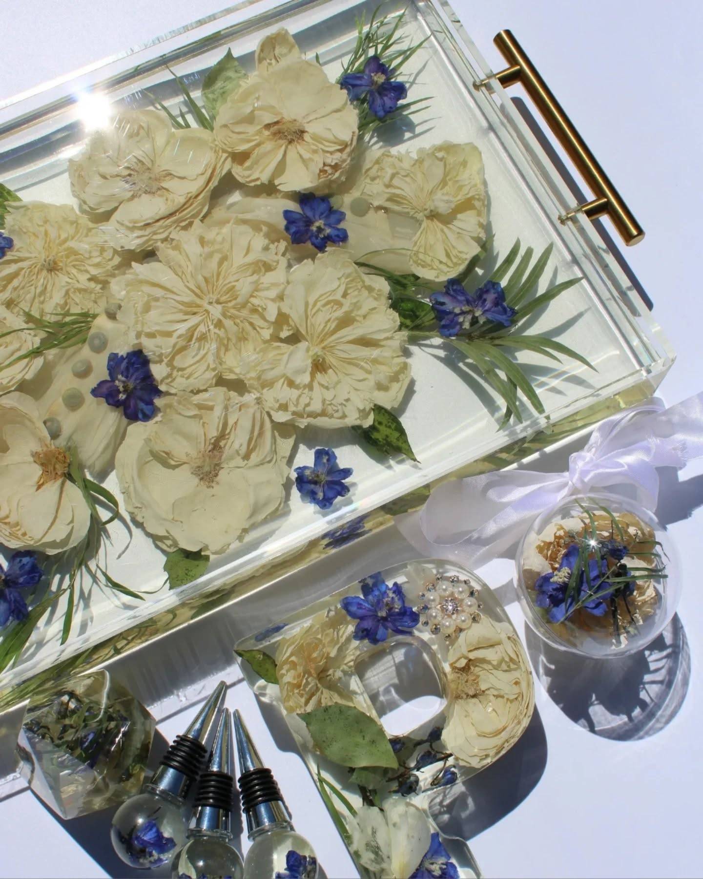 One bouquet.
Many forever pieces. 💐

A tray, letter block, ring holder, ornament, and wine stoppers... all made from the same preserved flowers.

Your bouquet doesn't have to fade away. Preserve yours now. Link in bio.

#flowerpreservation #preservedflowers #bouquetpreservation #weddingbouquet #resinkeepsake