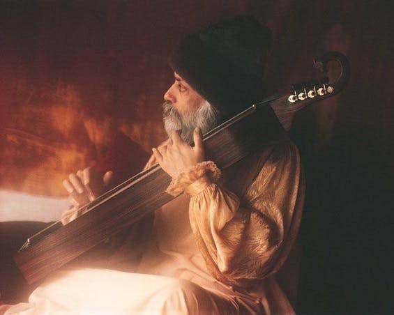 Osho with music instrument