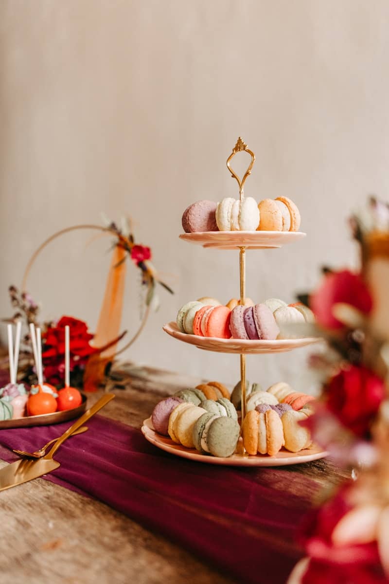 A table topped with three tiered trays of food