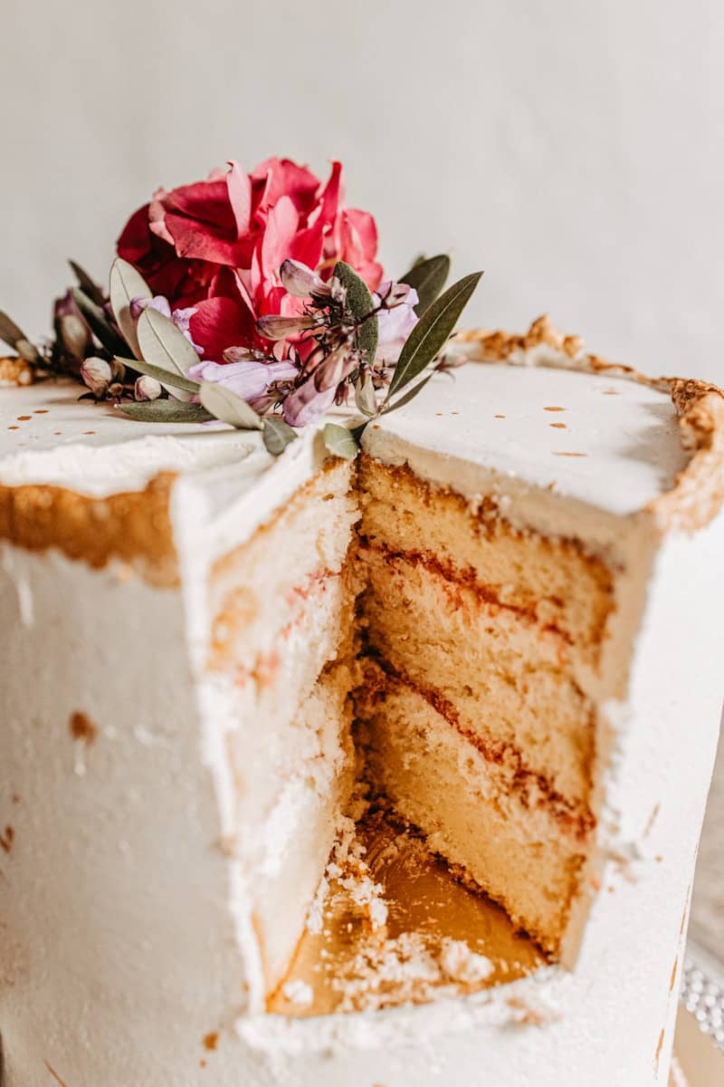 A piece of cake with a flower on top of it