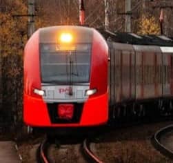 orange train on railroad during daytime