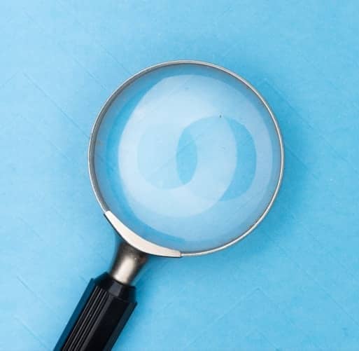 magnifying glass on white table