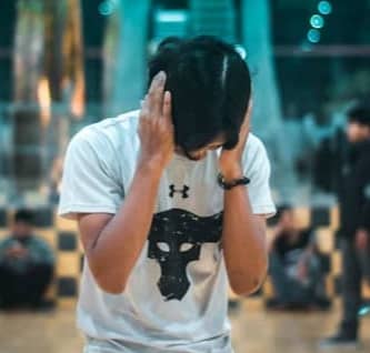 man closing his ear