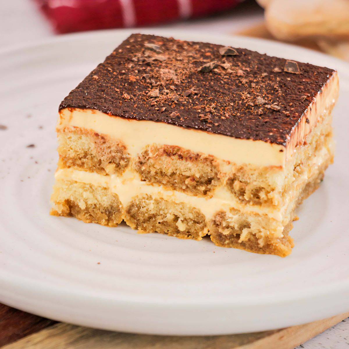 Classic Italian tiramisu with layers of espresso-soaked ladyfingers, mascarpone cream, and cocoa powder.