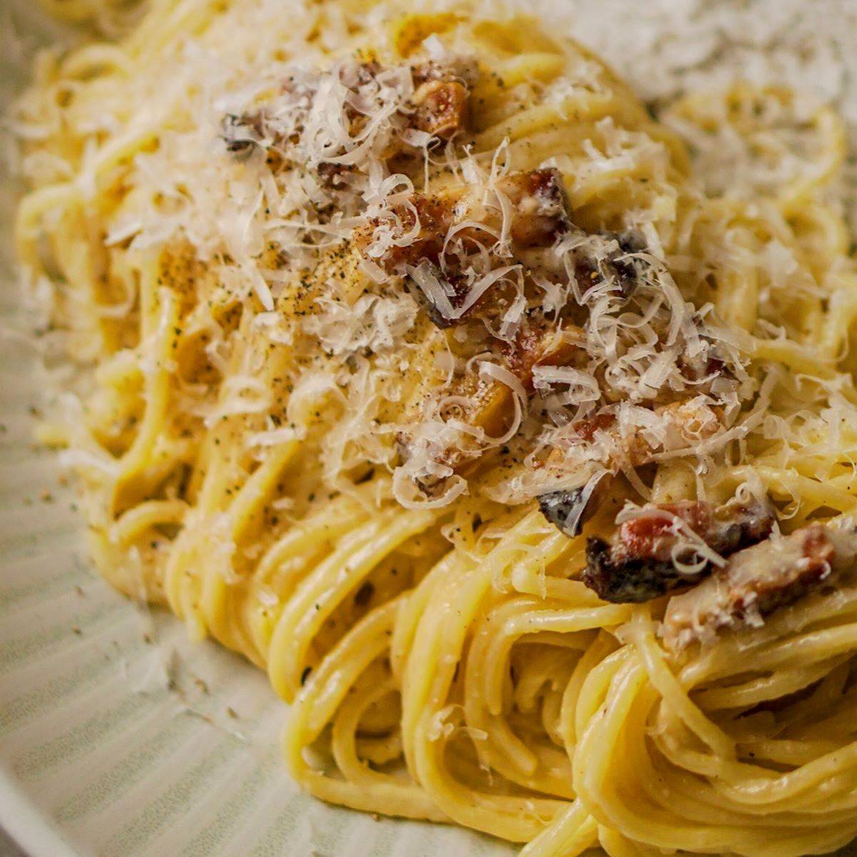 Traditional spaghetti alla carbonara with Pecorino Romano, guanciale, eggs, and black pepper