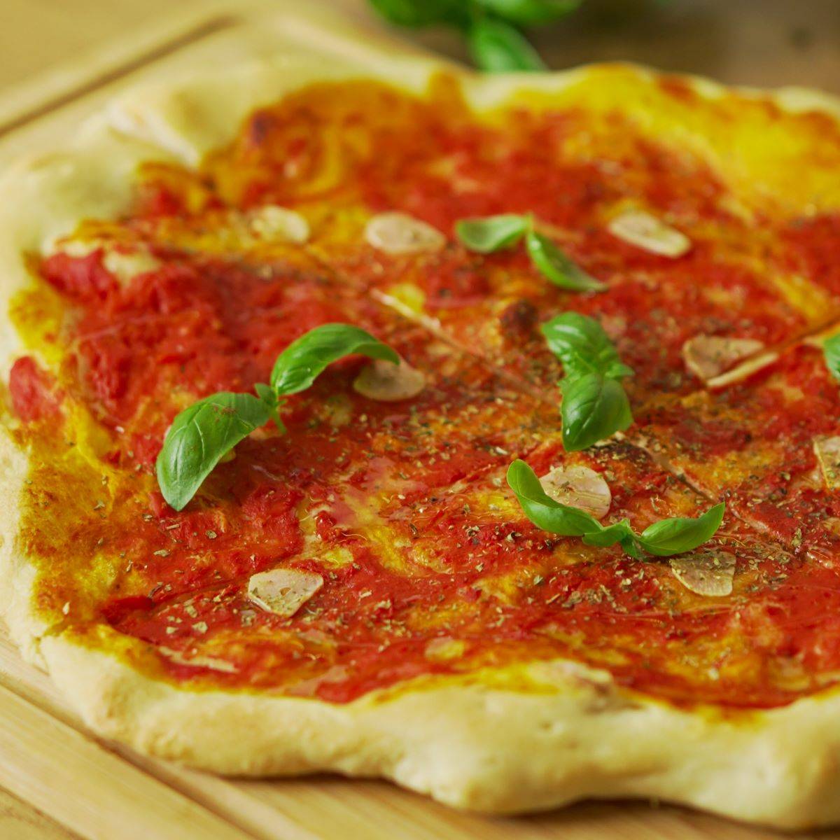 Classic Italian marinara pizza topped with tomato sauce, garlic, olive oil, and oregano.