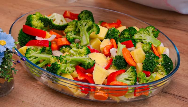 Raw vegetables in a glass baking dish