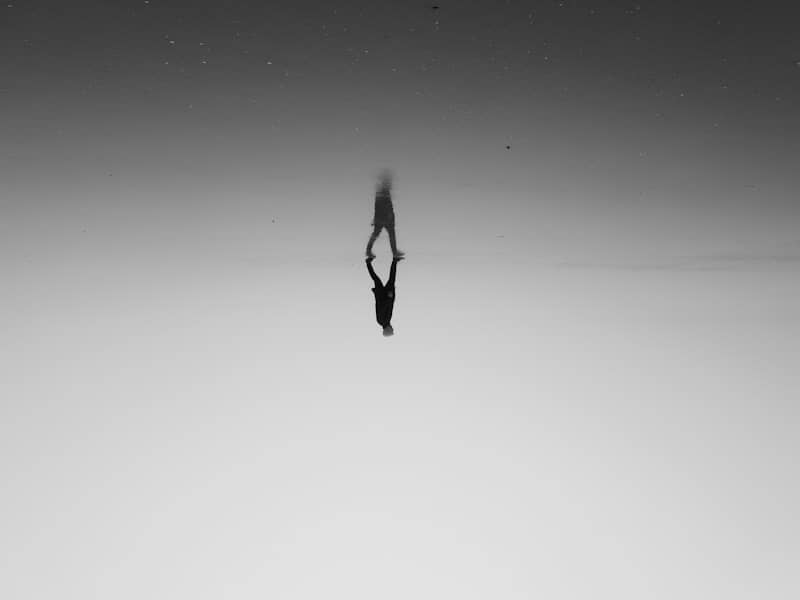 a person standing in the middle of a body of water