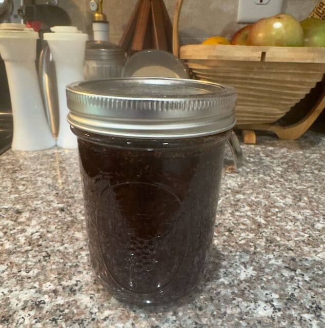 A jar of fig chutney on the kitchen counter