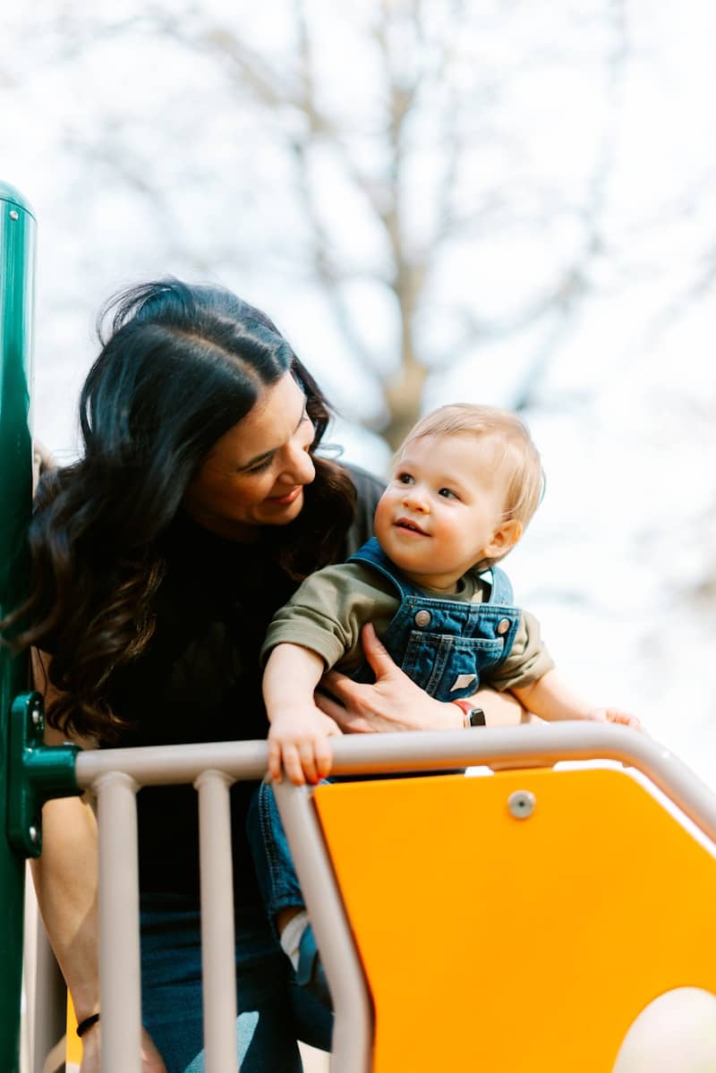 Mother and child on a playground slide