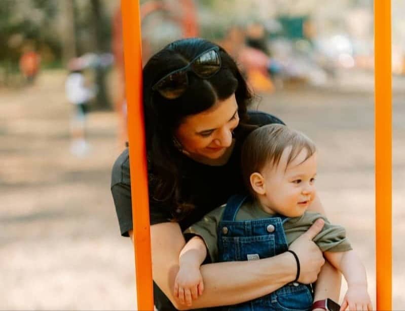 Mother and child on a playground ladder