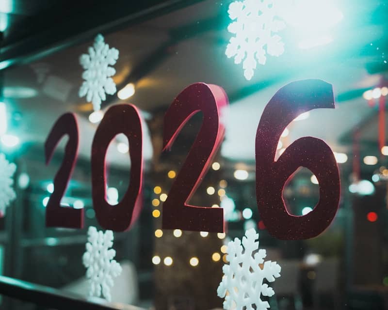 Red 2026 numbers with snowflakes on window