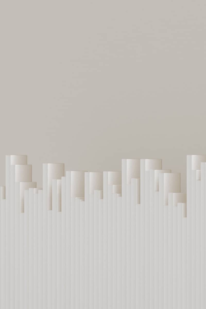 Abstract skyline comprised of cylinders and lines.