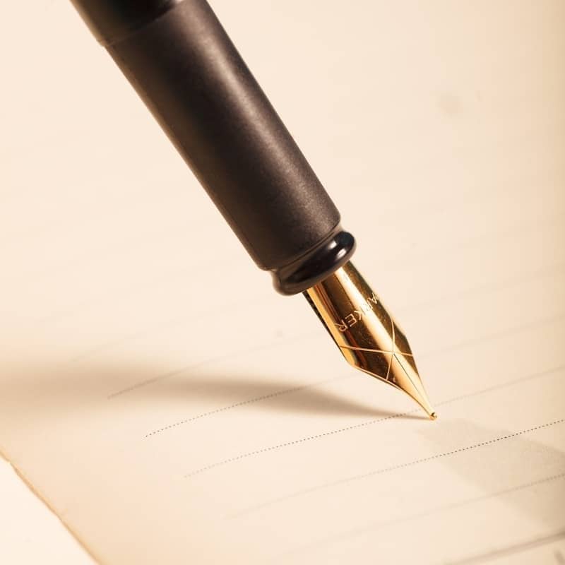 A black fountain pen ready to write.