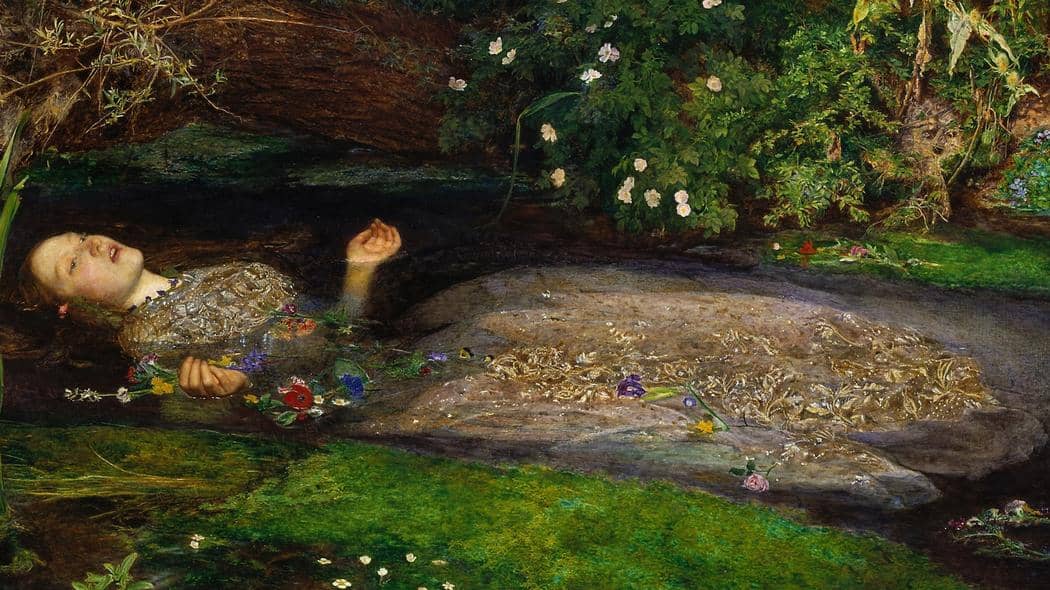 Painting “Ophelia” by John Everett Millais (1851–52). A young woman floats on her back in a stream, her ornate dress spread out in the water, surrounded by wildflowers. Her head is tilted back, eyes half-closed, arms extended upward, as if suspended between life and death.