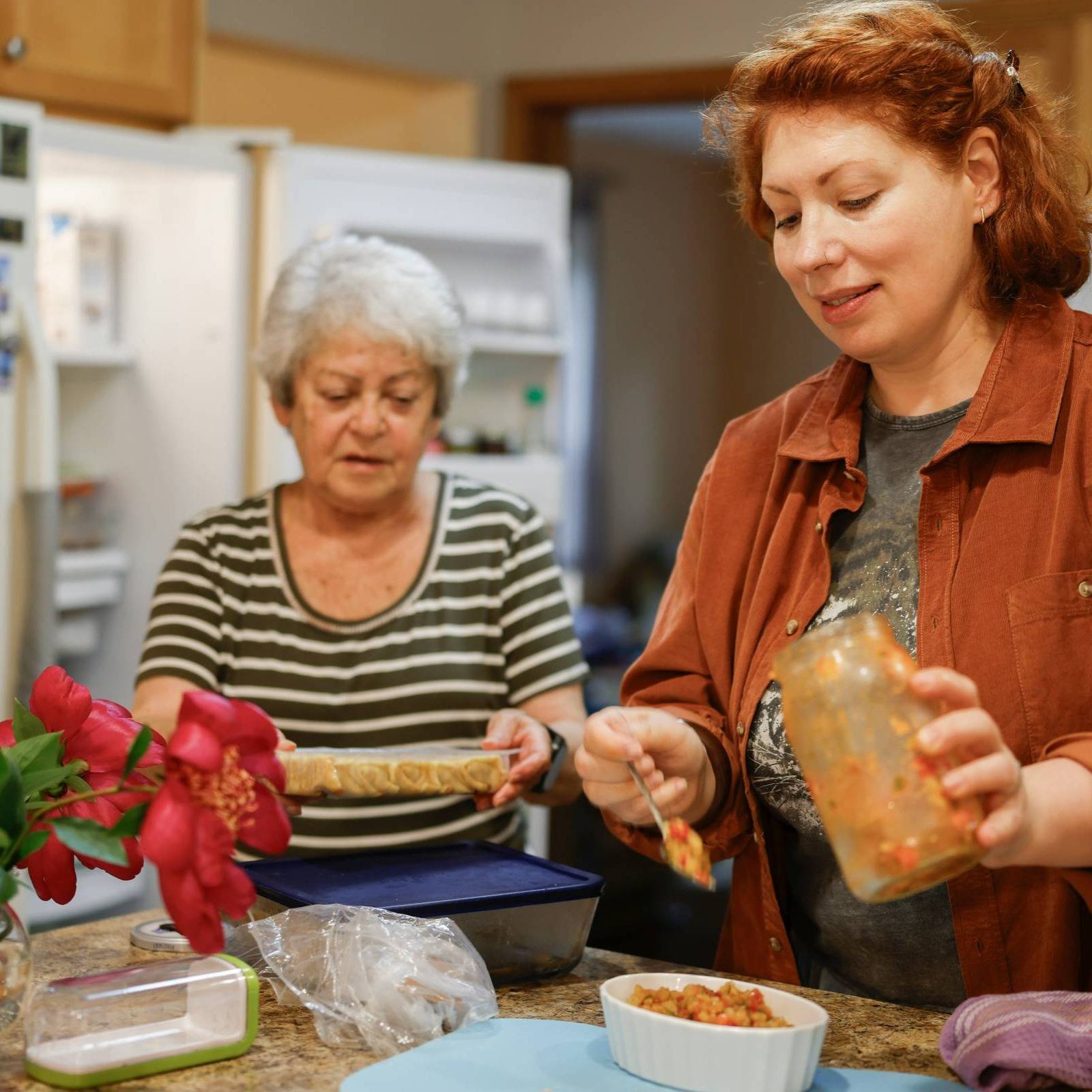 Modern bathroom with marble accents and a large plant.