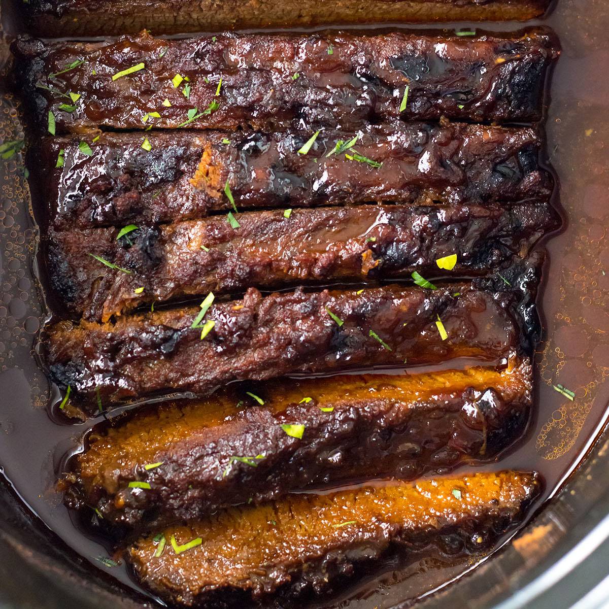 sliced brisket in a crockpot.