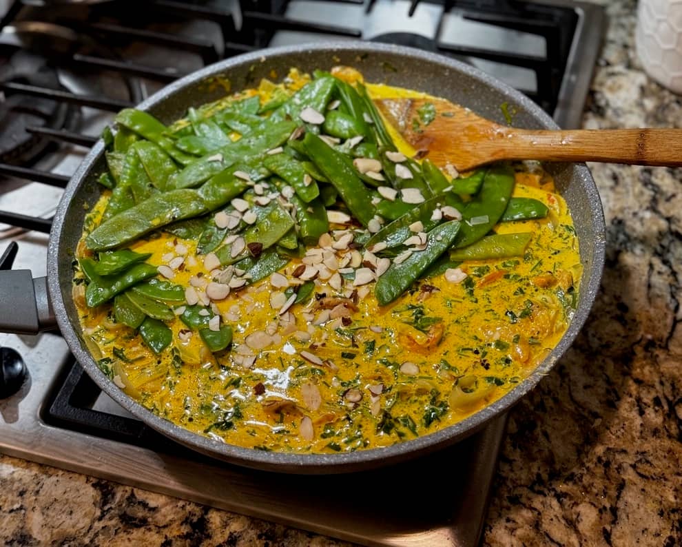 Aerial picture of sauté pan with Turmeric Shrimp Pasta sauce